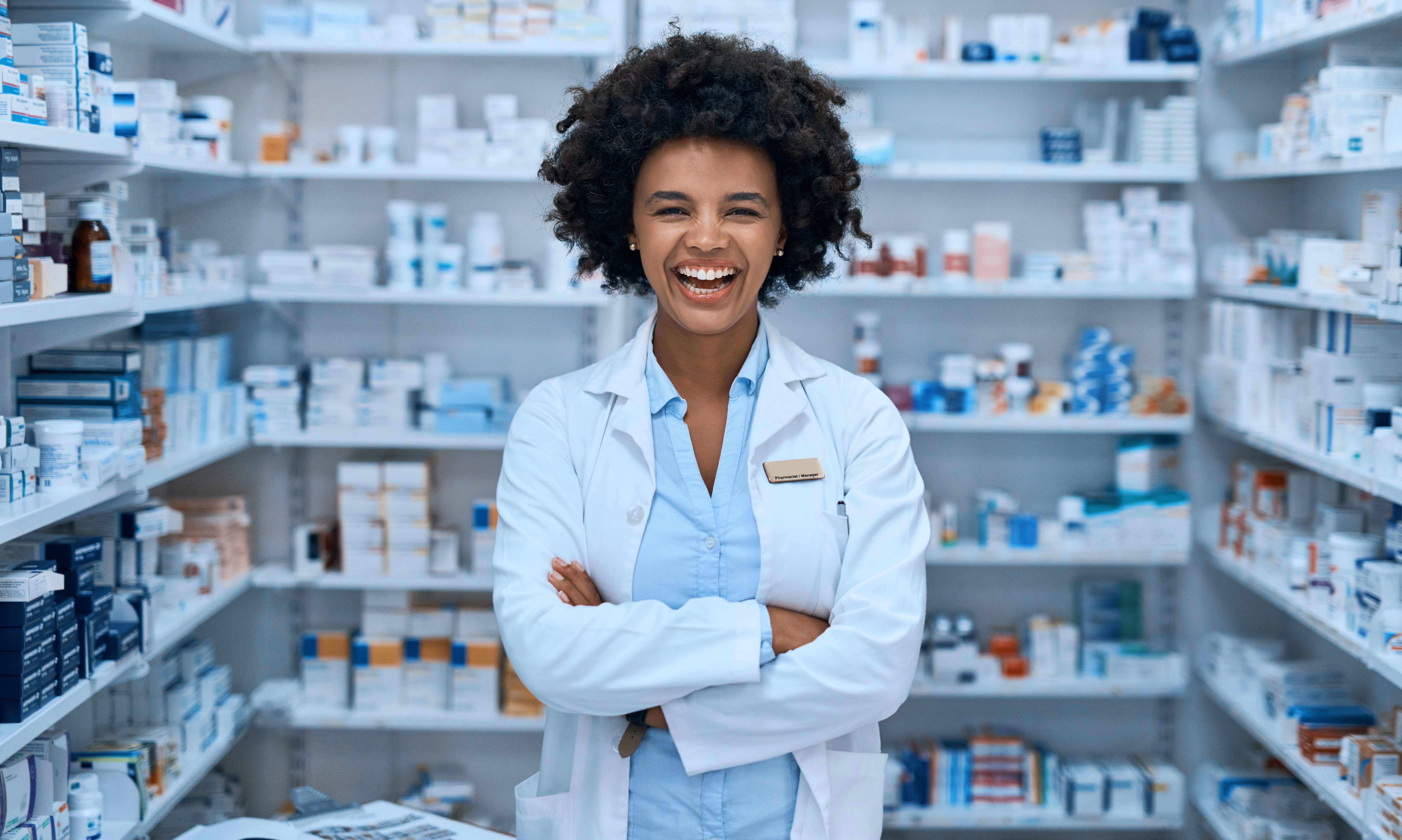 Portrait of a confident young woman working in a pharmacy.